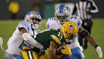 GREEN BAY, WI - NOVEMBER 06: Trevor Davis #11 of the Green Bay Packers is tackled by Nevin Lawson #24 and Tavon Wilson #32 of the Detroit Lions at Lambeau Field on September 28, 2017 in Green Bay, Wisconsin. The Lions defeated the Packers 30-17. (Photo by Jonathan Daniel/Getty Images)