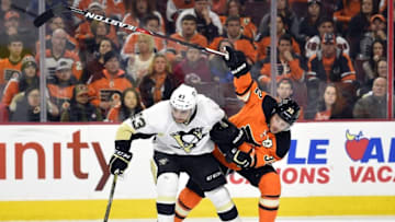 Apr 9, 2016; Philadelphia, PA, USA; Pittsburgh Penguins left wing Conor Sheary (43) and Philadelphia Flyers defenseman Mark Streit (32) battle for the puck during the first period at Wells Fargo Center. Mandatory Credit: Derik Hamilton-USA TODAY Sports