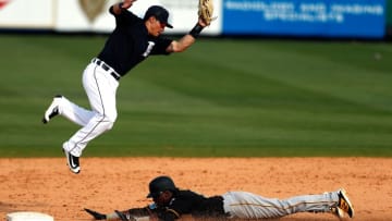 Mar 1, 2016; Lakeland, FL, USA; Detroit Tigers shortstop Tommy Field (74) catches a throw as Pittsburgh Pirates player Josh Harrison (5) slides safely into second during the ninth inning at Joker Marchant Stadium. Mandatory Credit: Butch Dill-USA TODAY Sports