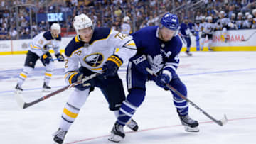 TORONTO, ON - SEPTEMBER 21: Toronto Maple Leafs Defenceman Morgan Rielly (44) and Buffalo Sabres Right Wing Tage Thompson (72) skate after the puck during the NHL preseason game between the Buffalo Sabres and the Toronto Maple Leafs on September 21, 2018, at Scotiabank Arena in Toronto, ON, Canada. (Photograph by Julian Avram/Icon Sportswire via Getty Images)