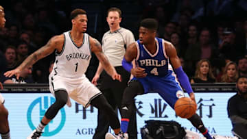 Mar 15, 2016; Brooklyn, NY, USA; Philadelphia 76ers forward Nerlens Noel (4) looks to drive around Brooklyn Nets forward Chris McCullough (1) during the second quarter at Barclays Center. Mandatory Credit: Anthony Gruppuso-USA TODAY Sports