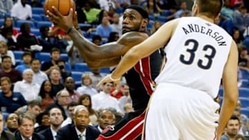 Oct 23, 2013; New Orleans, LA, USA; Miami Heat small forward LeBron James (6) is guarded by New Orleans Pelicans power forward Ryan Anderson (33) during the second half of a preseason game at New Orleans Arena. The Heat defeated the Pelicans 108-95. Mandatory Credit: Derick E. Hingle-USA TODAY Sports