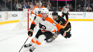 Dec 9, 2022; Las Vegas, Nevada, USA; Philadelphia Flyers defenseman Cam York (45) skates ahead of Vegas Golden Knights center Paul Cotter (43) during the second period at T-Mobile Arena. Mandatory Credit: Stephen R. Sylvanie-USA TODAY Sports