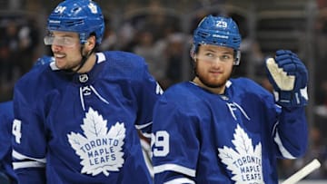 William Nylander #29 of the Toronto Maple Leafs celebrates his 1st goal of the season against the Minnesota Wild with teammate Auston Matthews #34. (Photo by Claus Andersen/Getty Images)