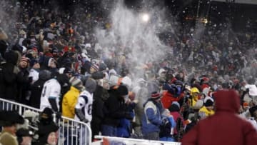 Dec 30, 2012; Foxborough, MA, USA; New England Patriots fans throw snow to celebrate New England Patriots running back Stevan Ridley (22) touchdown against the Miami Dolphins during the second quarter at Gillette Stadium. Mandatory Credit: David Butler II-USA TODAY Sports