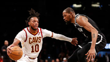 NEW YORK, NEW YORK - APRIL 12: Darius Garland #10 of the Cleveland Cavaliers dribbles against Kevin Durant #7 of the Brooklyn Nets during the second half of the Eastern Conference 2022 Play-In Tournament at Barclays Center on April 12, 2022 in the Brooklyn borough of New York City. The Nets won 115-108. NOTE TO USER: User expressly acknowledges and agrees that, by downloading and or using this photograph, User is consenting to the terms and conditions of the Getty Images License Agreement. (Photo by Sarah Stier/Getty Images)