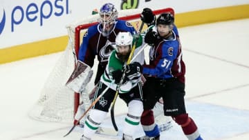 Oct 15, 2016; Denver, CO, USA; Colorado Avalanche goalie Semyon Varlamov (1) looks on as defenseman Fedor Tyutin (51) and Dallas Stars right wing Patrick Eaves (18) battle for position in the second period at the Pepsi Center. Mandatory Credit: Isaiah J. Downing-USA TODAY Sports