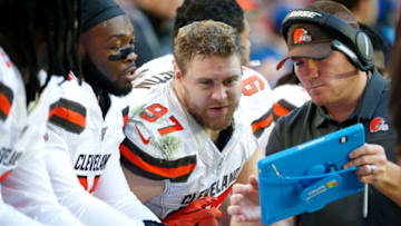 GLENDALE, ARIZONA - DECEMBER 15: Defensive end Porter Gustin #97 of the Cleveland Browns looks to a Microsoft Surface tablet during the first half of the NFL football game against the Arizona Cardinals at State Farm Stadium on December 15, 2019 in Glendale, Arizona. (Photo by Ralph Freso/Getty Images)