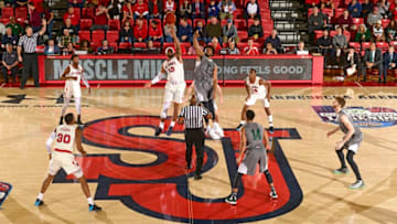 NEW YORK, NY - NOVEMBER 06: Marvin Clark II #13 of the St. John's Red Storm and KaVaughn Scott #1 of the Loyola-Maryland Greyhounds battle for the opening tip-off at Carnesecca Arena on November 6, 2018 in New York City. (Photo by Steven Ryan/Getty Images)