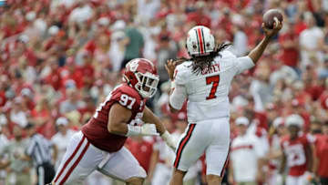 NORMAN, OK - SEPTEMBER 28: Quarterback Jett Duffey #7 of the Texas Tech Red Raiders throws under pressure from defensive lineman Marquise Overton #97 of the Oklahoma Sooners at Gaylord Family Oklahoma Memorial Stadium on September 28, 2019 in Norman, Oklahoma. The Sooners defeated the Red Raiders 55-16. (Photo by Brett Deering/Getty Images)