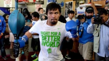 Apr 2, 2014; Hollywood, CA, USA; Manny Pacquiao on a speed bag during his media day workout at Wild Card Boxing Club. Mandatory Credit: Jayne Kamin-Oncea-USA TODAY Sports