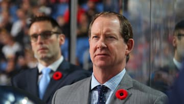 BUFFALO, NY - NOVEMBER 7: Buffalo Sabres head coach Phil Housley wears a poppy on his lapel during an NHL game against the Washington Capitalson November 7, 2017 at KeyBank Center in Buffalo, New York. (Photo by Bill Wippert/NHLI via Getty Images)