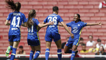 Chelsea's Reanna Blades (R) celebrates with teammates after scoring during the pre-season friendly women's football match between Arsenal and Chelsea at The Emirates Stadium in north London on August 1, 2021 (Photo by ADRIAN DENNIS/AFP via Getty Images)