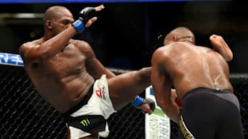 ANAHEIM, CA - JULY 29: (L-R) Jon Jones lands a kick to the head of Daniel Cormier in their UFC light heavyweight championship bout during the UFC 214 event inside the Honda Center on July 29, 2017 in Anaheim, California. (Photo by Jeff Bottari/Zuffa LLC/Zuffa LLC via Getty Images)