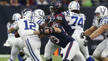 HOUSTON, TX - DECEMBER 09: Andrew Luck #12 of the Indianapolis Colts is sacked by J.J. Watt #99 of the Houston Texans during the third quarter at NRG Stadium on December 9, 2018 in Houston, Texas. (Photo by Bob Levey/Getty Images)