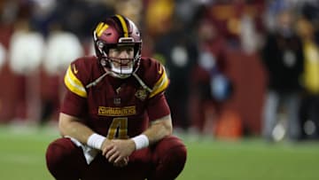LANDOVER, MARYLAND - DECEMBER 18: Taylor Heinicke #4 of the Washington Commanders looks on after failing to score during the fourth quarter against the New York Giants at FedExField on December 18, 2022 in Landover, Maryland. (Photo by Rob Carr/Getty Images)