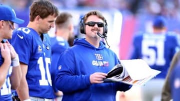 Dec 6, 2015; East Rutherford, NJ, USA; New York Giants quarterback Eli Manning (10) and offensive coordinator Ben McAdoo look at the playbook during the second quarter against the New York Jets at MetLife Stadium. Mandatory Credit: Brad Penner-USA TODAY Sports