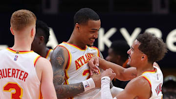 ATLANTA, GEORGIA - NOVEMBER 14: John Collins #20 of the Atlanta Hawks reacts with Trae Young #11 after drawing a the fifth foul from Giannis Antetokounmpo #34 of the Milwaukee Bucks during the second half at State Farm Arena on November 14, 2021 in Atlanta, Georgia. NOTE TO USER: User expressly acknowledges and agrees that, by downloading and or using this photograph, User is consenting to the terms and conditions of the Getty Images License Agreement. (Photo by Kevin C. Cox/Getty Images)