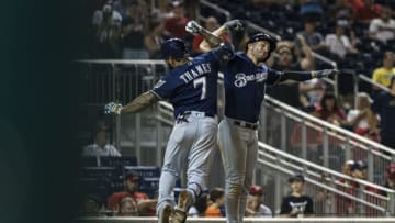 WASHINGTON, DC - AUGUST 17: Eric Thames #7 of the Milwaukee Brewers celebrates with Ryan Braun #8 after hitting a two-run home run against the Washington Nationals during the fourteenth inning at Nationals Park on August 17, 2019 in Washington, DC. (Photo by Scott Taetsch/Getty Images)