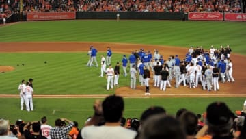 Jun 7, 2016; Baltimore, MD, USA; Baltimore Orioles shortstop Manny Machado (bottom left) is restrained during a brawl against the Kansas City Royals at Oriole Park at Camden Yards. Mandatory Credit: Evan Habeeb-USA TODAY Sports