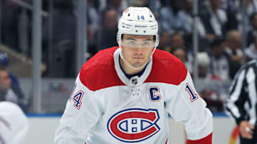 TORONTO, CANADA - OCTOBER 11: Nick Suzuki #14 of the Montreal Canadiens waits for a faceoff against the Toronto Maple Leafs during the 3rd period in an NHL game at Scotiabank Arena on October 11, 2023 in Toronto, Ontario, Canada. The Maple Leafs defeated the Canadiens 6-5 in a shootout. (Photo by Claus Andersen/Getty Images)