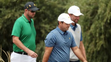MELBOURNE, AUSTRALIA - DECEMBER 13: Patrick Reed of the United States team, Webb Simpson of the United States team and Marc Leishman of Australia and the International team walk on the seventh hole during Friday foursome matches on day two of the 2019 Presidents Cup at Royal Melbourne Golf Course on December 13, 2019 in Melbourne, Australia. (Photo by Rob Carr/Getty Images)