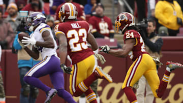 LANDOVER, MD - NOVEMBER 12: Wide receiver Stefon Diggs #14 of the Minnesota Vikings makes a catch past free safety DeAngelo Hall #23 of the Washington Redskins during the first quarter at FedExField on November 12, 2017 in Landover, Maryland. (Photo by Patrick Smith/Getty Images)