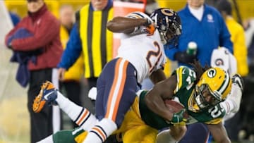 Nov 4, 2013; Green Bay, WI, USA; Green Bay Packers running back Eddie Lacy (27) is tackled by Chicago Bears safety Major Wright (21) and defensive tackle Zach Minter (96) during the first quarter at Lambeau Field. Mandatory Credit: Jeff Hanisch-USA TODAY Sports