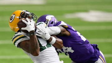 MINNEAPOLIS, MINNESOTA - SEPTEMBER 13: Davante Adams #17 of the Green Bay Packers catches the ball against Holton Hill #24 of the Minnesota Vikings during the fourth quarter of the game at U.S. Bank Stadium on September 13, 2020 in Minneapolis, Minnesota. The Packers defeated the Vikings 43-34. (Photo by Hannah Foslien/Getty Images)
