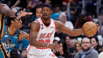 Apr 4, 2023; Detroit, Michigan, USA; Miami Heat forward Jimmy Butler (22) dribbles defended by Detroit Pistons guard Jaden Ivey (23) in the first half at Little Caesars Arena. Mandatory Credit: Rick Osentoski-USA TODAY Sports