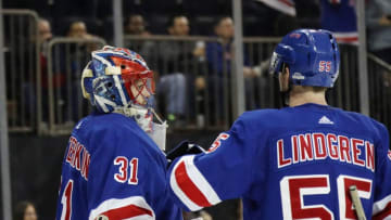 NEW YORK, NEW YORK - JANUARY 31: Igor Shesterkin #31 and Ryan Lindgren #55 of the New York Rangers celebrate their 4-2 victory over the Detroit Red Wings at Madison Square Garden on January 31, 2020 in New York City. (Photo by Bruce Bennett/Getty Images)