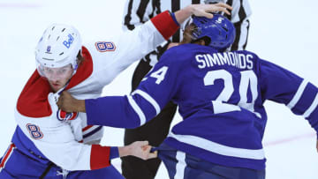 TORONTO, ON - JANUARY 13: Ben Chiarot #8 of the Montreal Canadiens fights Wayne Simmonds #24 of the Toronto Maple Leafs during an NHL game at Scotiabank Arena on January 13, 2021 in Toronto, Ontario, Canada. The Maple Leafs defeated the Canadiens 5-4 in overtime. (Photo by Claus Andersen/Getty Images)