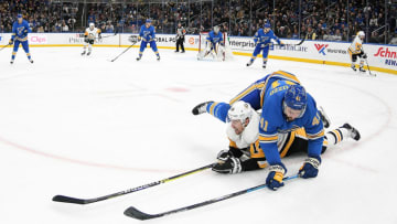 ST. LOUIS, MO. - DECEMBER 29: St. Louis Blues defenseman Robert Bortuzzo (41) falls over Pittsburgh Penguins leftwing Tanner Pearson (14) while going after a loose puck during an NHL game between the Pittsburgh Penguins and the St. Louis Blues on December 29, 2018, at Enterprise Center, St. Louis, MO. (Photo by Keith Gillett/Icon Sportswire via Getty Images)