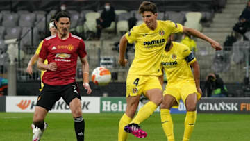 Villarreal's Spanish defender Pau Torres (R) clears the ball ahead of Manchester United's Uruguayan striker Edinson Cavani during the UEFA Europa League final football match between Villarreal CF and Manchester United at the Gdansk Stadium in Gdansk on May 26, 2021. (Photo by Janek Skarzynski / POOL / AFP) (Photo by JANEK SKARZYNSKI/POOL/AFP via Getty Images)