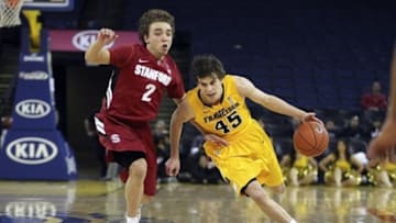 November 09, 2012; Oakland, CA, USA; San Francisco Dons guard Cody Doolin (45) drives in against Stanford Cardinal guard Aaron Bright (2) during the second half at Oracle Arena. The Stanford Cardinal defeated the San Francisco Dons 74-62. Mandatory Credit: Kelley L Cox-USA TODAY Sports