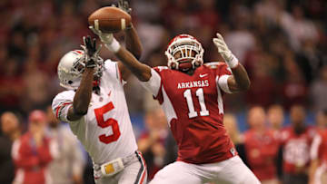 Jan 4, 2011; New Orleans, LA, USA; Arkansas Razorbacks receiver Cobi Hamilton (11) has a pass broken up by Ohio State Buckeyes cornerback Chimdi Chekwa (5) in the second quarter during the 2011 Sugar Bowl at the Louisiana Superdome . Chekwa was injured on the play. Mandatory Credit: Matthew Emmons-USA TODAY Sports