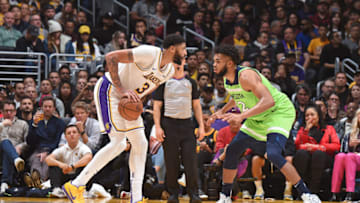 LOS ANGELES, CA - DECEMBER 8: Karl-Anthony Towns #32 of the Minnesota Timberwolves plays defense on Anthony Davis #3 of the Los Angeles Lakers on December 8, 2019 at STAPLES Center in Los Angeles, California. NOTE TO USER: User expressly acknowledges and agrees that, by downloading and/or using this Photograph, user is consenting to the terms and conditions of the Getty Images License Agreement. Mandatory Copyright Notice: Copyright 2019 NBAE (Photo by Adam Pantozzi/NBAE via Getty Images)