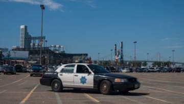 Jul 27, 2014; San Francisco, CA, USA; A San Francisco Police Officer monitors the parking lot outside of AT&T Park before the game between the San Francisco Giants and Los Angeles Dodgers. Mandatory Credit: Ed Szczepanski-USA TODAY Sports