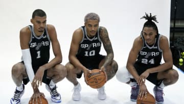 San Antonio Spurs center Victor Wembanyama (1) poses for photos with forwards guard Devin Vassell (24) and Jeremy Sochan (10) during media day in San Antonio, Scott Wachter-USA TODAY Sports