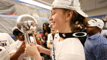 WASHINGTON, DC -  OCTOBER 10: Emma Meesseman #33 of the Washington Mystics smiles with the WNBA Championship Trophy after Game Five of the 2019 WNBA Finals on October 10, 2019 at St Elizabeths East Entertainment & Sports Arena in Washington, DC. NOTE TO USER: User expressly acknowledges and agrees that, by downloading and or using this Photograph, user is consenting to the terms and conditions of the Getty Images License Agreement. Mandatory Copyright Notice: Copyright 2019 NBAE (Photo by Ned Dishman/NBAE via Getty Images)