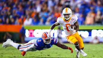 GAINESVILLE, FLORIDA - SEPTEMBER 25: Tiyon Evans #8 of the Tennessee Volunteers scores a touchdown against Amari Burney #2 of the Florida Gators during the first quarter of a game at Ben Hill Griffin Stadium on September 25, 2021 in Gainesville, Florida. (Photo by James Gilbert/Getty Images)