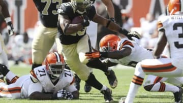 Sep 14, 2014; Cleveland, OH, USA; New Orleans Saints running back Pierre Thomas (23) looks for running room against the Cleveland Browns during the fourth quarter at FirstEnergy Stadium. The Browns won 26-24. Mandatory Credit: Ron Schwane-USA TODAY Sports