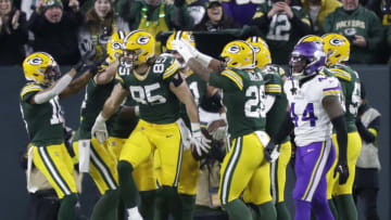 Jan 1, 2023; Green Bay, Wisconsin, USA; Green Bay Packers tight end Robert Tonyan (85) is sourrounded by teammates as he celebrates scoring a touchdown against the Minnesota Vikings during their game at Lambeau Field. Mandatory Credit: Dan Powers-USA TODAY Sports
