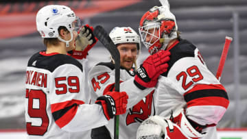 Mar 23, 2021; Philadelphia, Pennsylvania, USA; New Jersey Devils center Janne Kuokkanen (59), defenseman Sami Vatanen (45) and goaltender Mackenzie Blackwood (29) celebrate win against the Philadelphia Flyers during the third period at Wells Fargo Center. Mandatory Credit: Eric Hartline-USA TODAY Sports