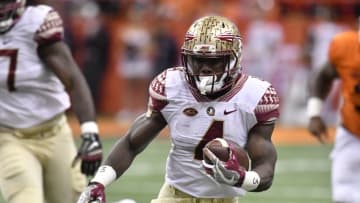 Nov 19, 2016; Syracuse, NY, USA; Florida State Seminoles running back Dalvin Cook (4) carries the ball during the first quarter of a game against the Syracuse Orange at the Carrier Dome. Mandatory Credit: Mark Konezny-USA TODAY Sports