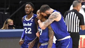 UNIVERSITY PARK PA - DECEMBER 06: Myles Cale #22, Shavar Reynolds #33 and Sandro Mamukelashvili #23 of the Seton Hall Pirates celebrate a win in overtime after a college basketball game against the Penn State Nittany Lions at the Bryce Jordan Center on December 6, 2020 in University Park, Pennsylvania. (Photo by Mitchell Layton/Getty Images)