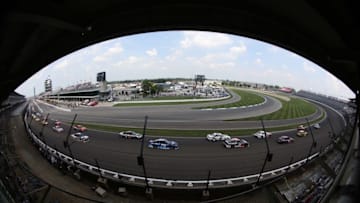 Jul 24, 2016; Indianapolis, IN, USA; NASCAR Sprint Cup driver Kyle Busch (18) leads the field on the parade lap for the start of the Combat Wounded Coalition 400 at the Brickyard at the Indianapolis Motor Speedway. Mandatory Credit: Brian Spurlock-USA TODAY Sports