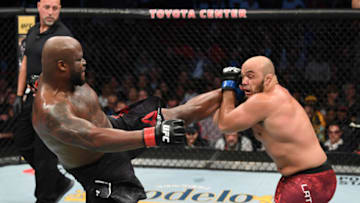 HOUSTON, TEXAS - FEBRUARY 08: (L-R) Derrick Lewis kicks Ilir Latifi of Sweden in their heavyweight bout during the UFC 247 event at Toyota Center on February 08, 2020 in Houston, Texas. (Photo by Josh Hedges/Zuffa LLC via Getty Images)
