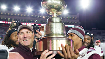 OXFORD, MS - NOVEMBER 26: Head Coach Dan Mullen of the Mississippi State Bulldogs celebrates with his team after winning the Egg Bowl against the Mississippi Rebels at Vaught-Hemingway Stadium on November 26, 2016 in Oxford, Mississippi. The Bulldogs defeated the Rebels 55-20. (Photo by Wesley Hitt/Getty Images)