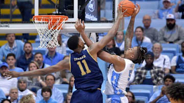 CHAPEL HILL, NORTH CAROLINA - NOVEMBER 06: Juwan Durham #11 of the Notre Dame Fighting Irish blocks a shot by Armando Bacot #5 of the North Carolina Tar Heels during the first half at the Dean Smith Center on November 06, 2019 in Chapel Hill, North Carolina. (Photo by Grant Halverson/Getty Images)